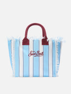 Fabric bracelet with light blue stripes and embroidery