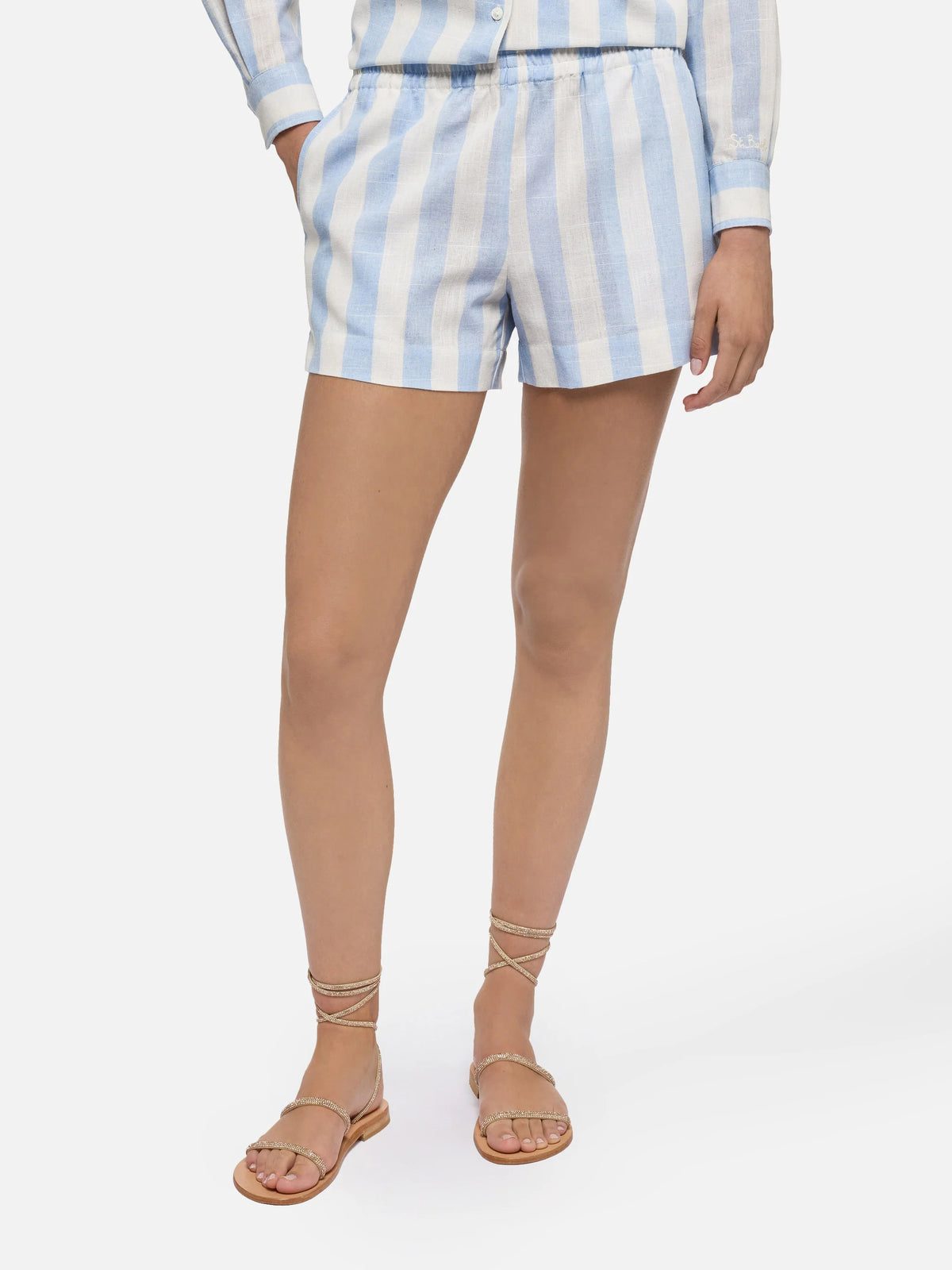 Lora one-piece swimsuit in sage green and cream striped design with Beach Club print