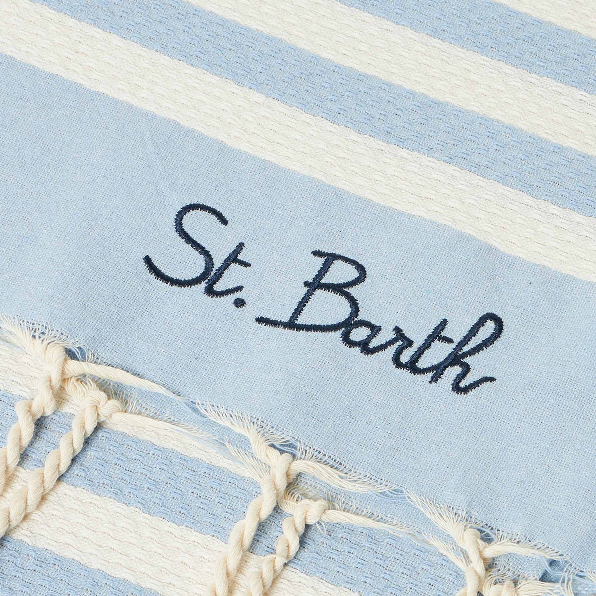 Fabric bracelet with light blue stripes and embroidery