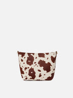 Aline bag in cow print pony hair with metal logo plaque
