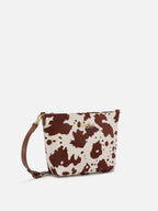 Aline bag in cow print pony hair with metal logo plaque