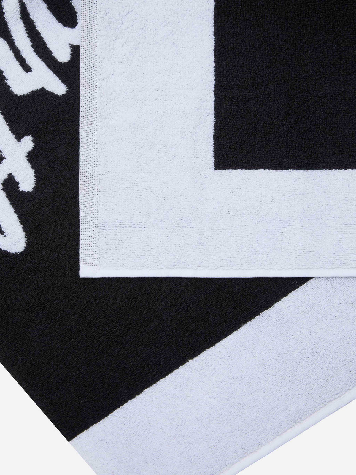 Black terry beach towel with white frame